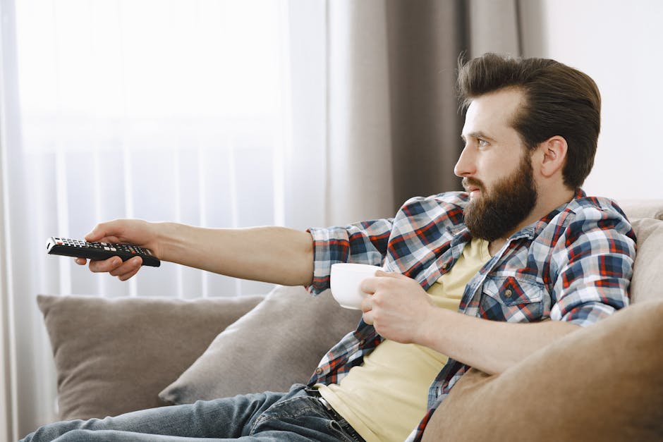 person watching tv internet sofa